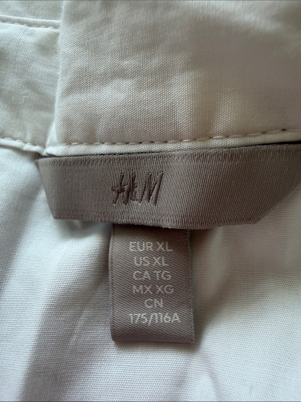 H&M White Top with Beige Logo Tag